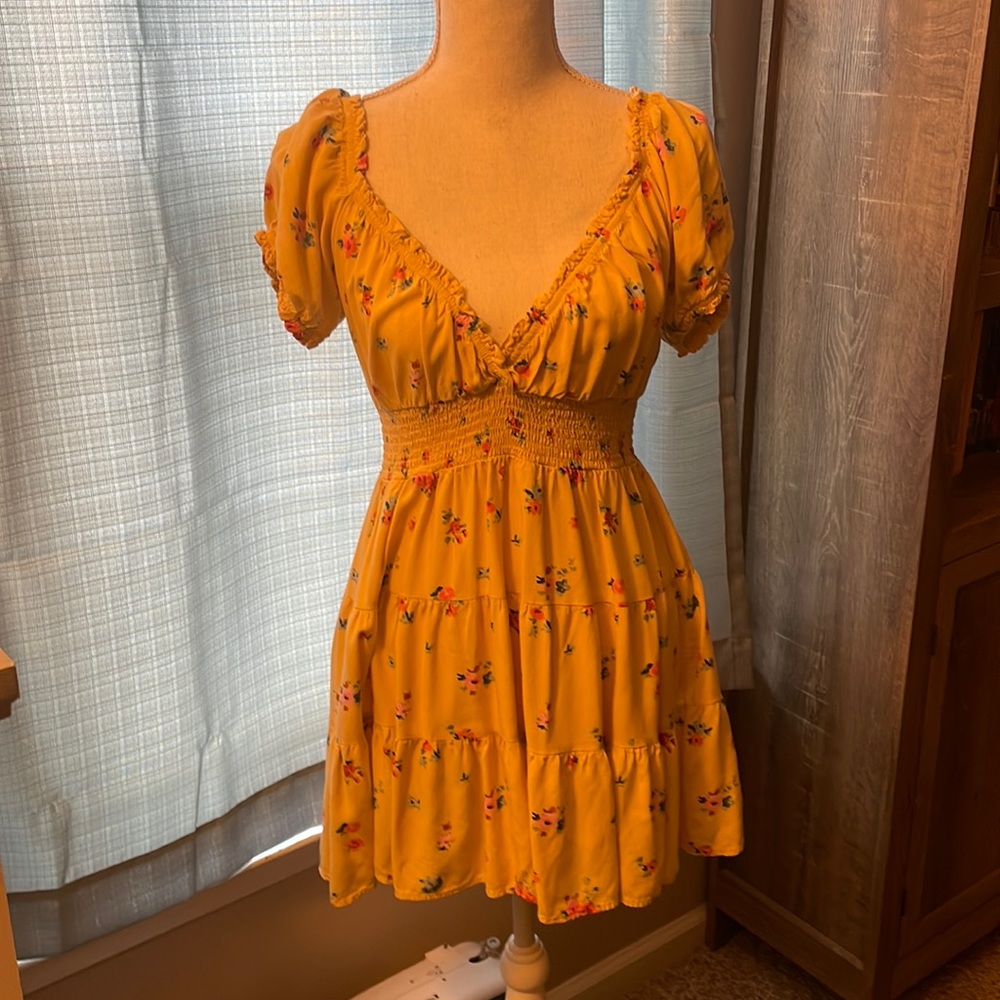Woman’s yellow dress